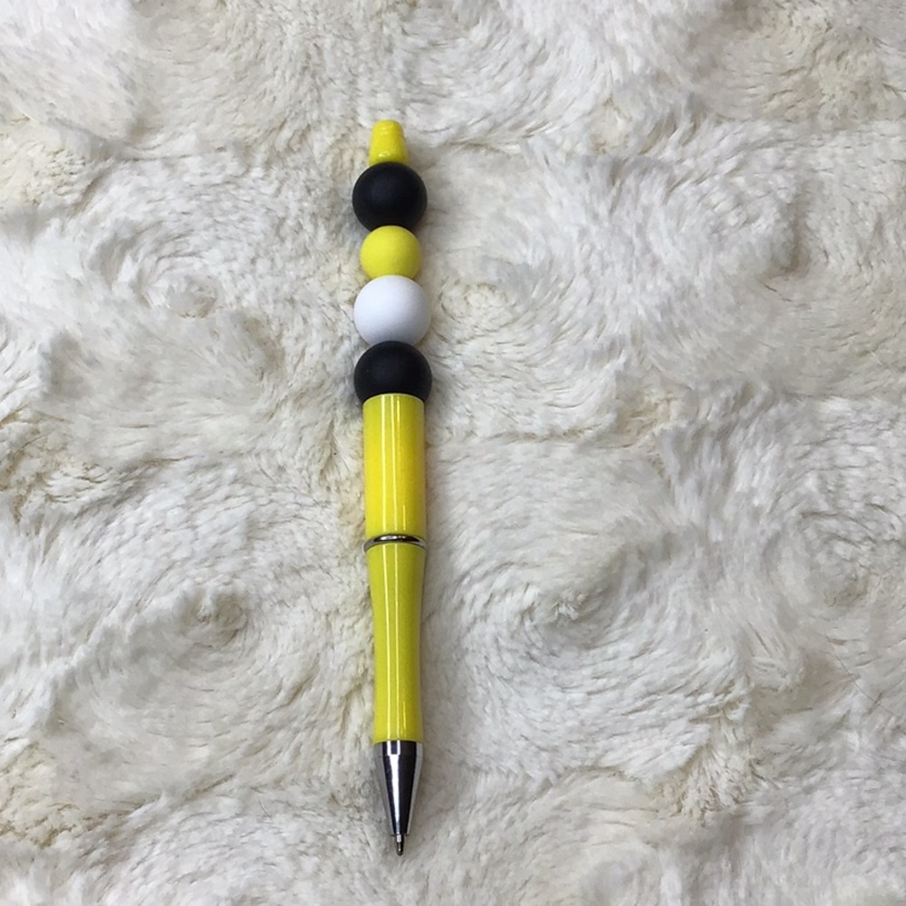 Handcrafted beaded pen. Yellow/black/white. Made with bpa free silicone